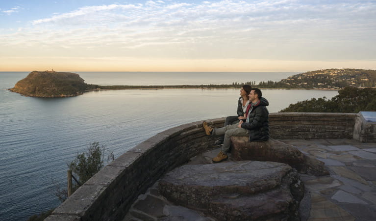 A couple enjoys the view at West Head lookout in Ku-ring-gai Chase National Park. Photo: John Spencer/OEH